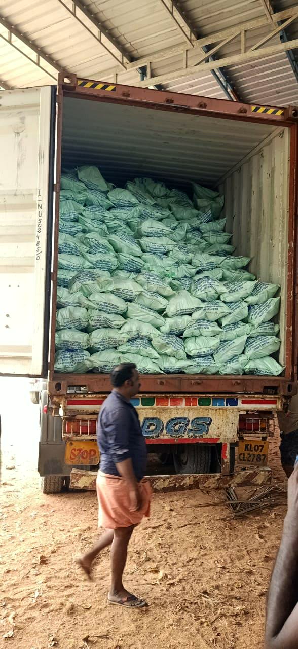 A container loaded with bags of coconut at the packhouse